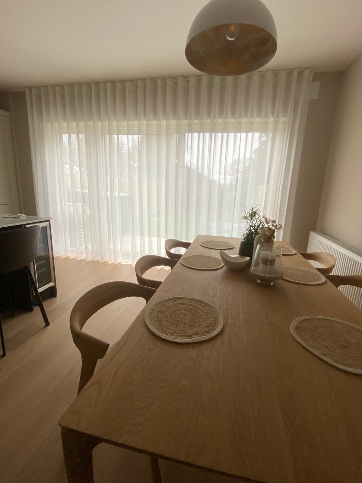 open plan living area with voile curtains