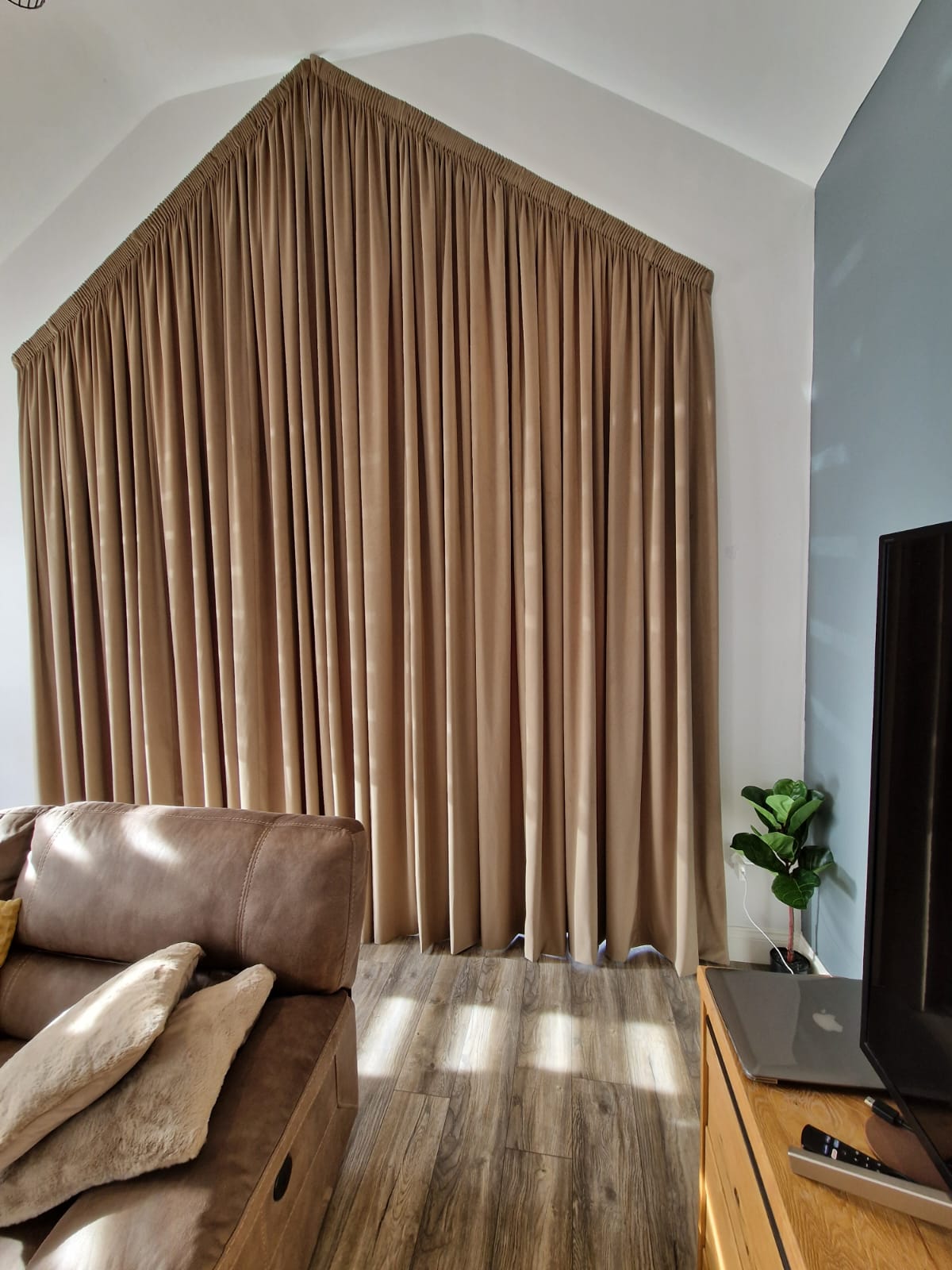 bow bay window with sash windows, roman blinds and curtains that are cream and custom-made